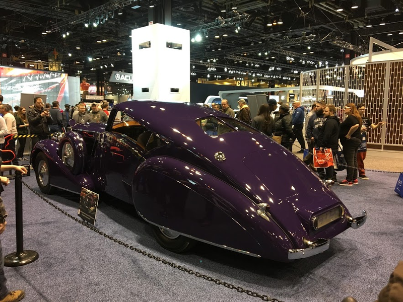 A very large, very purple Rolls.